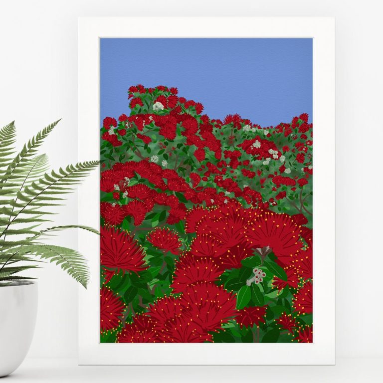 A framed print of an illustration of a massive pōhutukawa tree in full bloom, in a white frame leaned against the wall on a white shelf, with a fern in a white pot beside it.